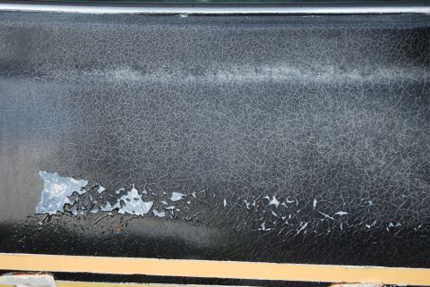 1975 Ford Ranchero - The paint on this 1975 Ford Ranchero shows significant cracking and peeling, revealing the underlying material.