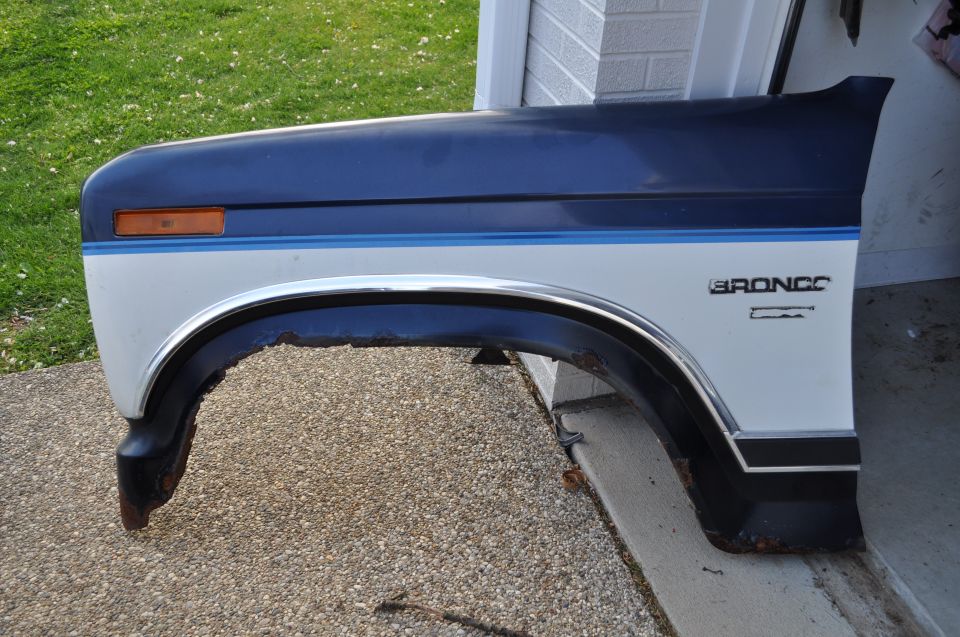Blue and white Ford Bronco fender with "BRONCO" badging