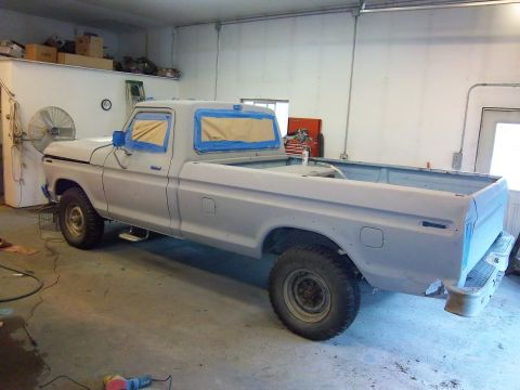 1978 Ford F-250 - This 1978 Ford F-250 pickup truck is prepped for painting, with its windows taped off.