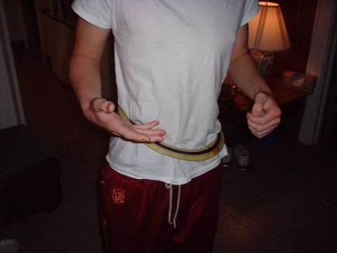 1996 Ford Taurus - A person is shown indoors, wearing a white t-shirt and red pants, with a belt around their waist.