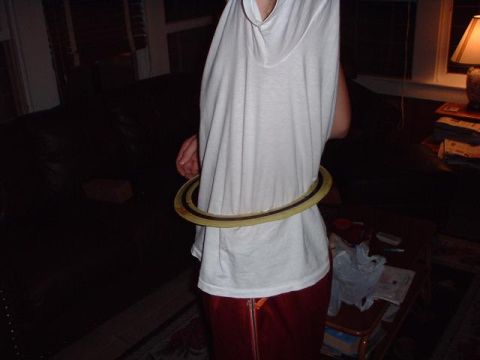 1996 Ford Taurus - A person is shown indoors wearing a hula hoop around their waist.