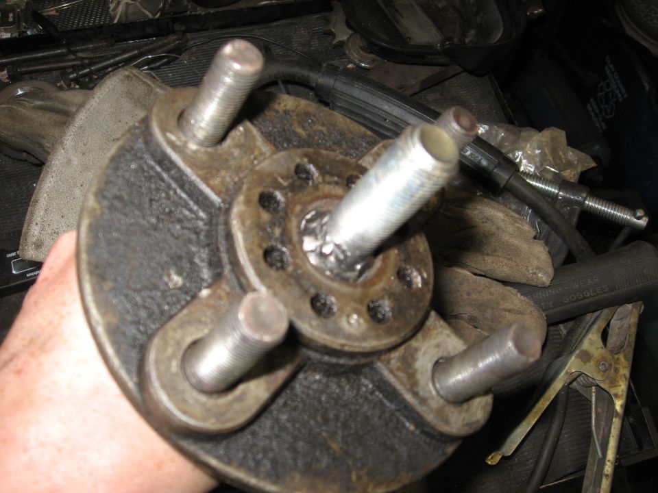 wheel hub assembly with threaded studs, held in hand