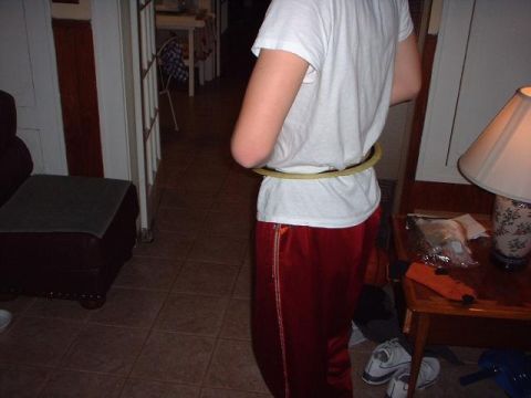 1996 Ford Taurus - A person is shown indoors with a hula hoop around their waist.