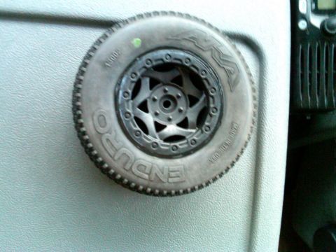 1986 Ford Bronco - A close-up view of a remote control car tire, the brand name 'ENDURO' and a distinctive five-spoke wheel design.
