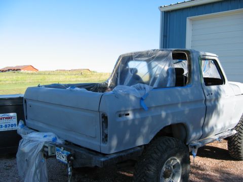 1978 Ford Bronco - This 1978 Ford Bronco is being prepped for a new paint job, with plastic covering the windows and bed.