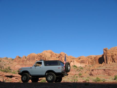 1978 Ford Bronco - This 1978 Ford Bronco is seen in a desert landscape with red rock formations under a clear blue sky.