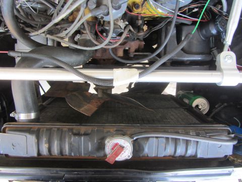 1964 Ford Ranchero - Close-up view of the engine bay of a 1964 Ford Ranchero, showing the radiator and fan assembly.