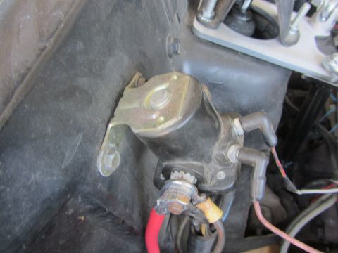 1964 Ford Ranchero - Ignition coil and associated wiring, part of a vehicle's electrical system.