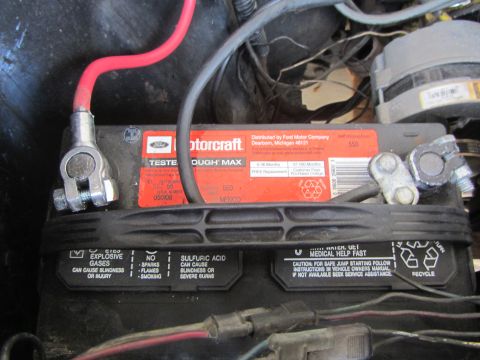 1964 Ford Ranchero - A Motorcraft battery is shown with its terminals and warning labels visible.