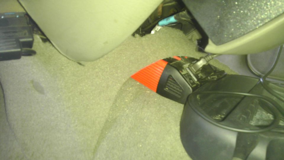 Orange and black interior part with visible text 'SUPERMOTORS'