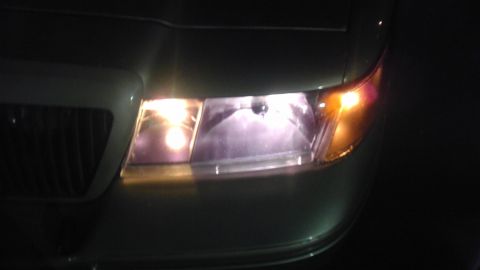 2000 Mercury Grand Marquis - Close-up of the front grille and headlight assembly on a 2000 Mercury Grand Marquis.