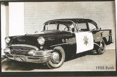 1991 Ford Crown Victoria - This 1955 Buick police car has a distinctive grille and star emblem on the door.