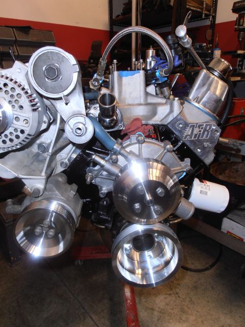 1990 Ford Bronco - Close-up of a custom engine build AFR valve covers and polished pulleys, likely a performance modification.