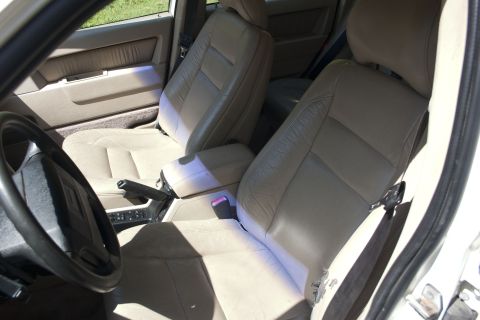 1997 Volvo 850 - Interior view of car seats, dashboard, and steering wheel.