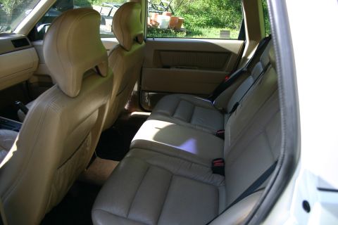 1997 Volvo 850 - Rear interior of a 1997 Volvo 850 station wagon with tan leather seats.