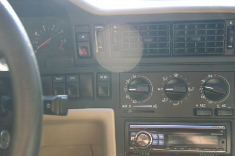 1997 Volvo 850 - Close-up of a car's dashboard, showing the instrument cluster and climate control system.