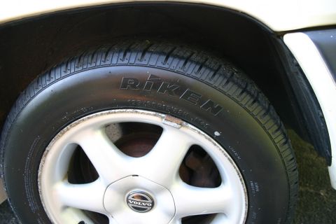 1997 Volvo 850 - Close-up of a Volvo wheel and Riken tire, showing the front passenger side of the vehicle.