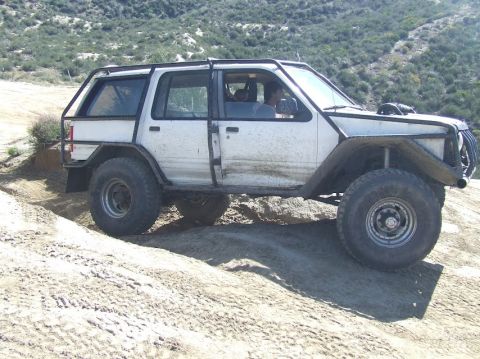 1978 Ford Bronco - This heavily modified SUV navigates a rocky, off-road terrain, its build and suspension.