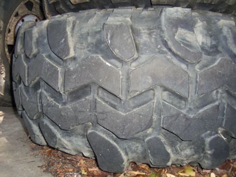 1968 Ford Bronco - This image shows a close-up of a single, heavily treaded off-road tire, not a 1968 Ford Bronco.