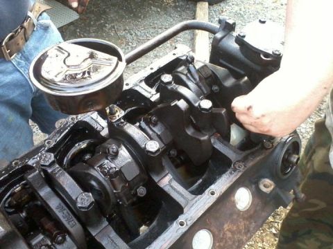 1989 Ford Bronco - Close-up of an engine block's internal components, including the crankshaft and connecting rods, during a rebuild.