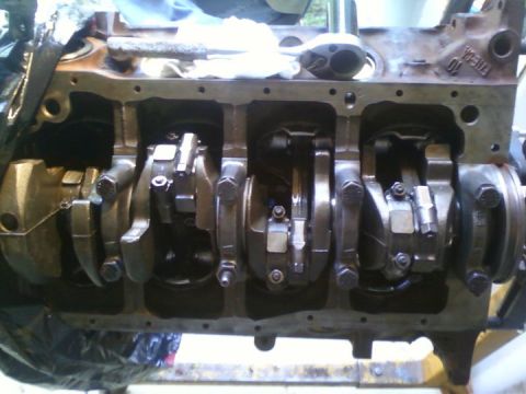 1989 Ford Bronco - Close-up view of an engine block's internal components, including the crankshaft and connecting rods.
