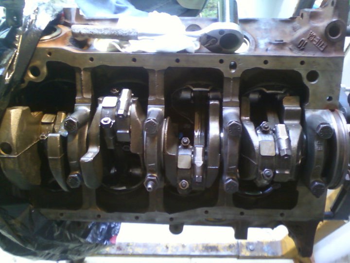 Engine block with crankshaft and connecting rods visible