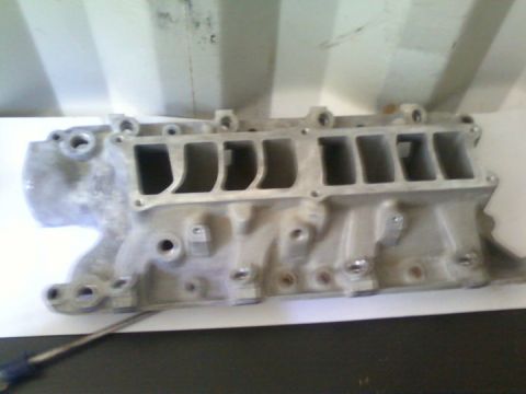 1989 Ford Bronco - Aluminum intake manifold with eight ports, likely for a V8 engine.