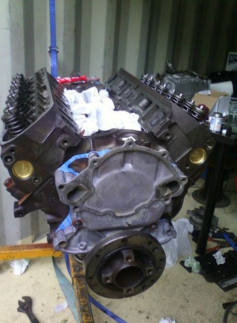 1989 Ford Bronco - A Ford V8 engine block is shown on an engine stand, partially assembled and ready for work.