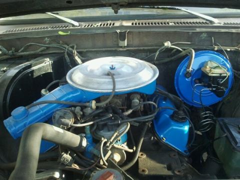 1979 Ford Bronco - Close-up view of the engine compartment, highlighting the air intake and brake system components.