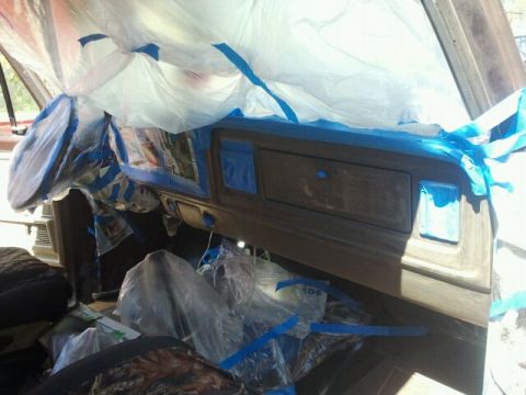 1979 Ford Bronco - Vehicle interior masked off with plastic sheeting and blue tape, ready for paintwork.