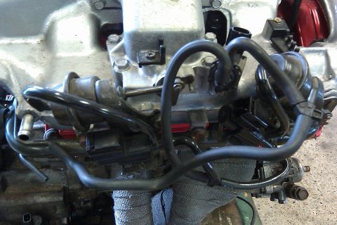 1996 Ford Probe - This is a close-up view of an engine's intake manifold and associated hoses.
