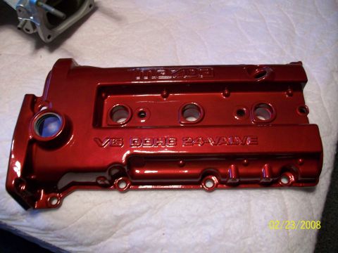 1996 Ford Probe - A red V6 DOHC 24-valve engine valve cover with the Mazda logo is shown.