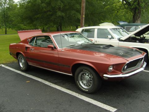 2007 Ford Mustang - Classic 1969 Ford Mustang Mach 1 with a black hood scoop and spoiler.