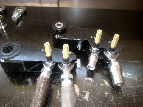 1996 Ford Bronco - Close-up view of automotive steering linkage components with visible measurement markings.