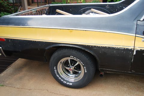 1975 Ford Ranchero - Rear side view of a 1975 Ford Ranchero, showing its distinctive two-tone paint scheme and BFGoodrich Radial T/A tires.
