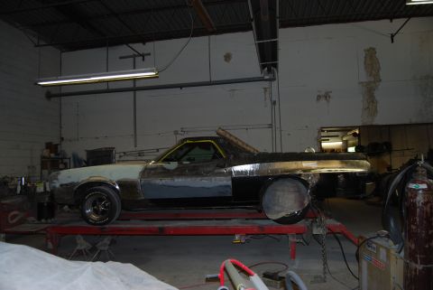 1975 Ford Ranchero - This 1975 Ford Ranchero is in a workshop, appearing to be in the middle of a restoration or repair process.