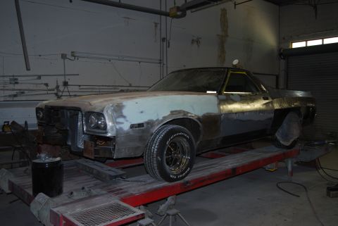 1975 Ford Ranchero - This vehicle is in a workshop, appearing to be in the middle of body repairs and customization.