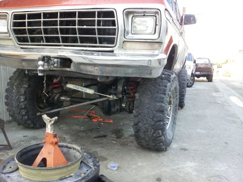 1978 Ford Bronco - Front view of a 1978 Ford Bronco, modified with large off-road tires and a lifted suspension system.