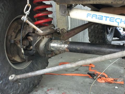 1978 Ford Bronco - Detailed view of off-road vehicle suspension and drivetrain components, including a Fabtech shock.