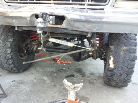 1978 Ford Bronco - Close-up of the front suspension and differential, a Fabtech shock absorber and heavy-duty components.