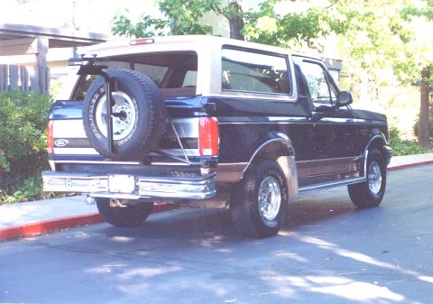 1994 Ford Bronco - This 1994 Ford Bronco is seen from the rear, a spare tire mounted externally on the tailgate.