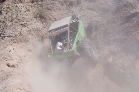 1981 Ford F-150 - This off-road buggy is navigating a steep, dusty incline.