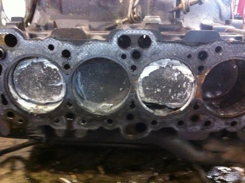 1990 Ford Bronco - This engine block shows significant damage to its pistons, indicating a severe mechanical failure.