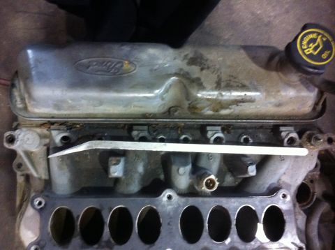 1990 Ford Bronco - Ford valve cover and intake manifold assembly, likely from a V8 engine.