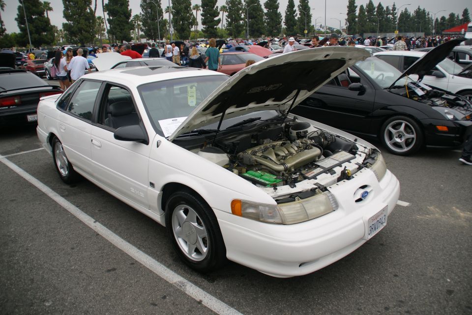 1993 Ford Taurus with hood open, front 3/4 view