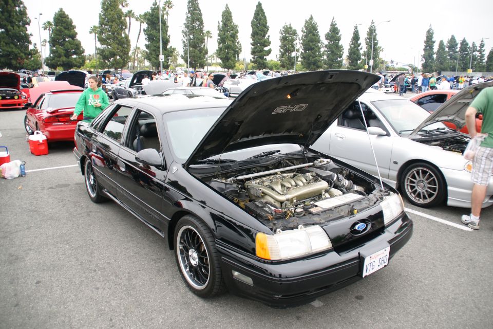 Black 1993 Ford Taurus SHO with hood open, front view