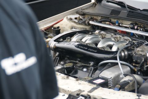 1993 Ford Taurus - Close-up view of a modified engine bay, focusing on the intake system and engine components.