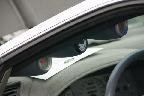 1993 Ford Taurus - Aftermarket gauges are installed on the dashboard of a car, showing engine data.
