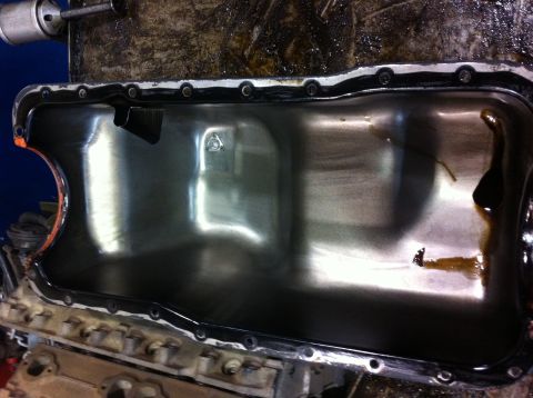 1990 Ford Bronco - The oil pan has been cleaned and is ready for installation on the engine.