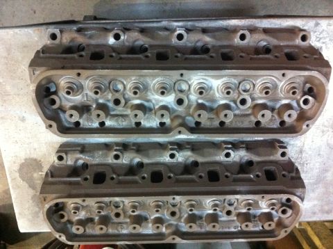 1990 Ford Bronco - Pair of engine cylinder heads, likely for a V8 engine, shown from above.